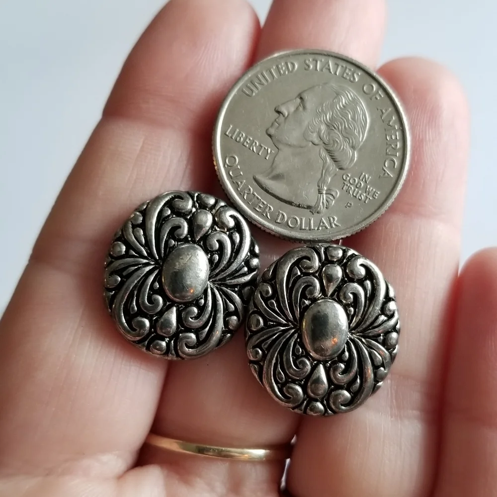 Earrings Silver tone earrings oval stud scrolled design